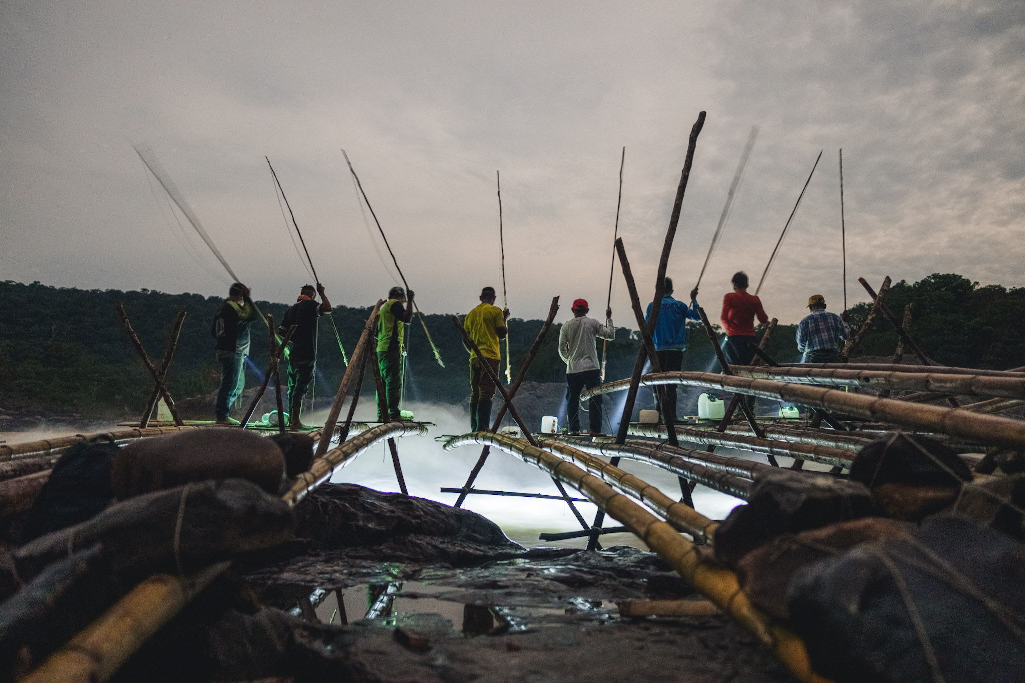 fishermen waiting for fish in the night in the colombian amazon