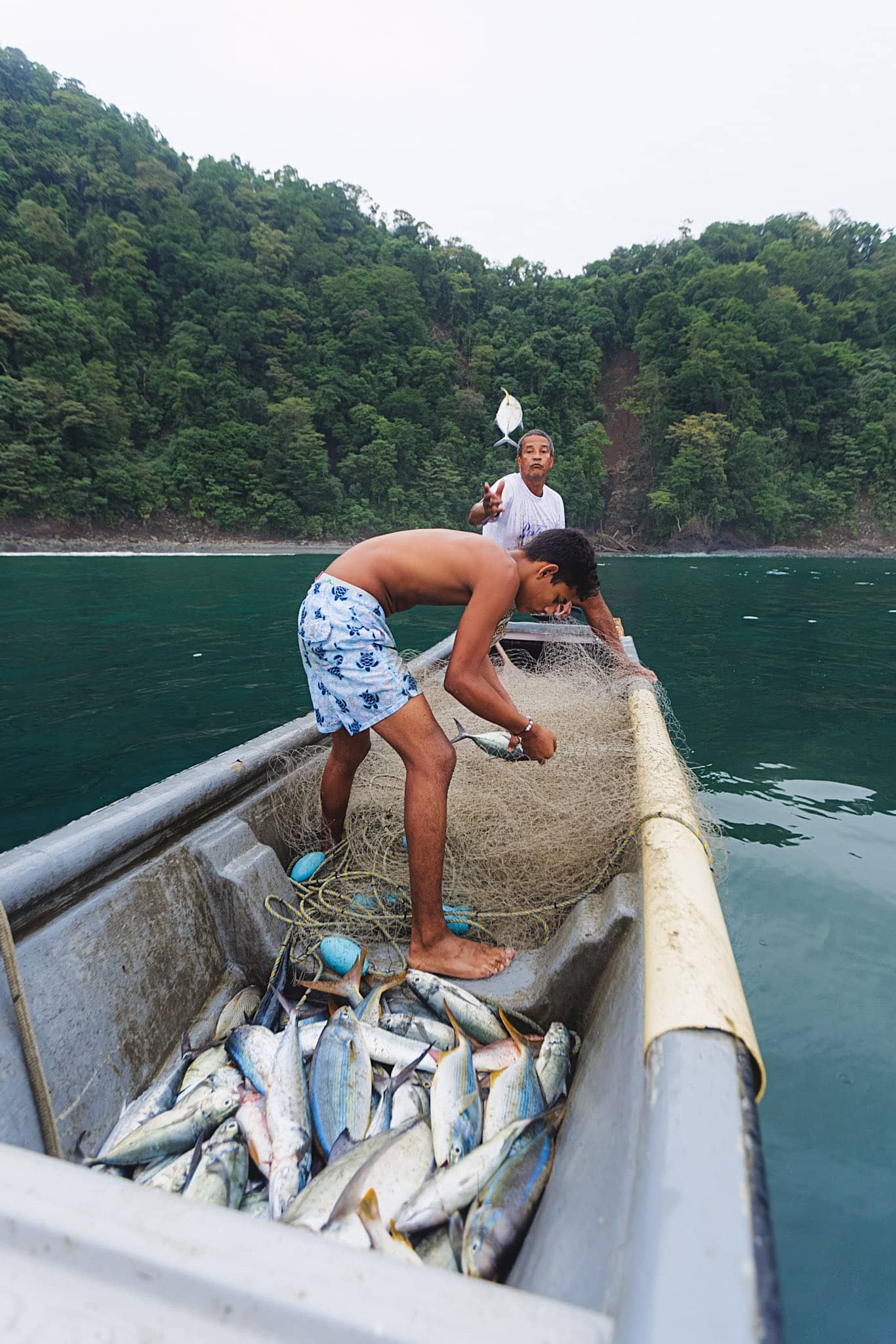 colombian fisherman pulling his net at sea in the choco colombia